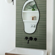 Green peel-and-stick backsplash tile Smart Tiles in a bathroom