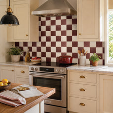 White and red damier peel and stick backsplash tile by Smart Tiles in a cream kitchen